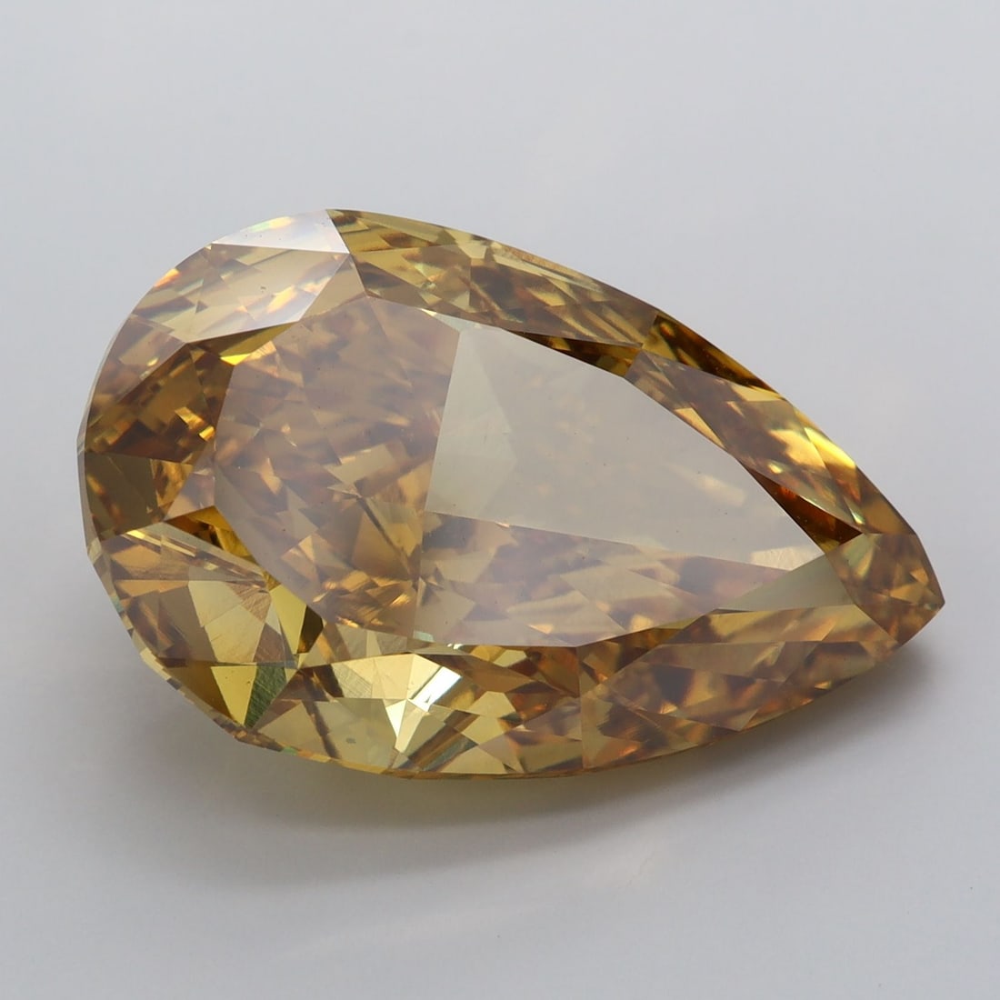 Loose Diamond - PEAR 15.07ct Fancy Vivid Brownish Yellow VS2: Loose Diamond - PEAR 15.07ct Fancy Vivid Brownish Yellow VS2 Source: This is a real non-mined Diamond that has been grown in a lab Shape: PEAR Carats: 15.07 Color: Fancy Vivid Brownish Yellow Certific