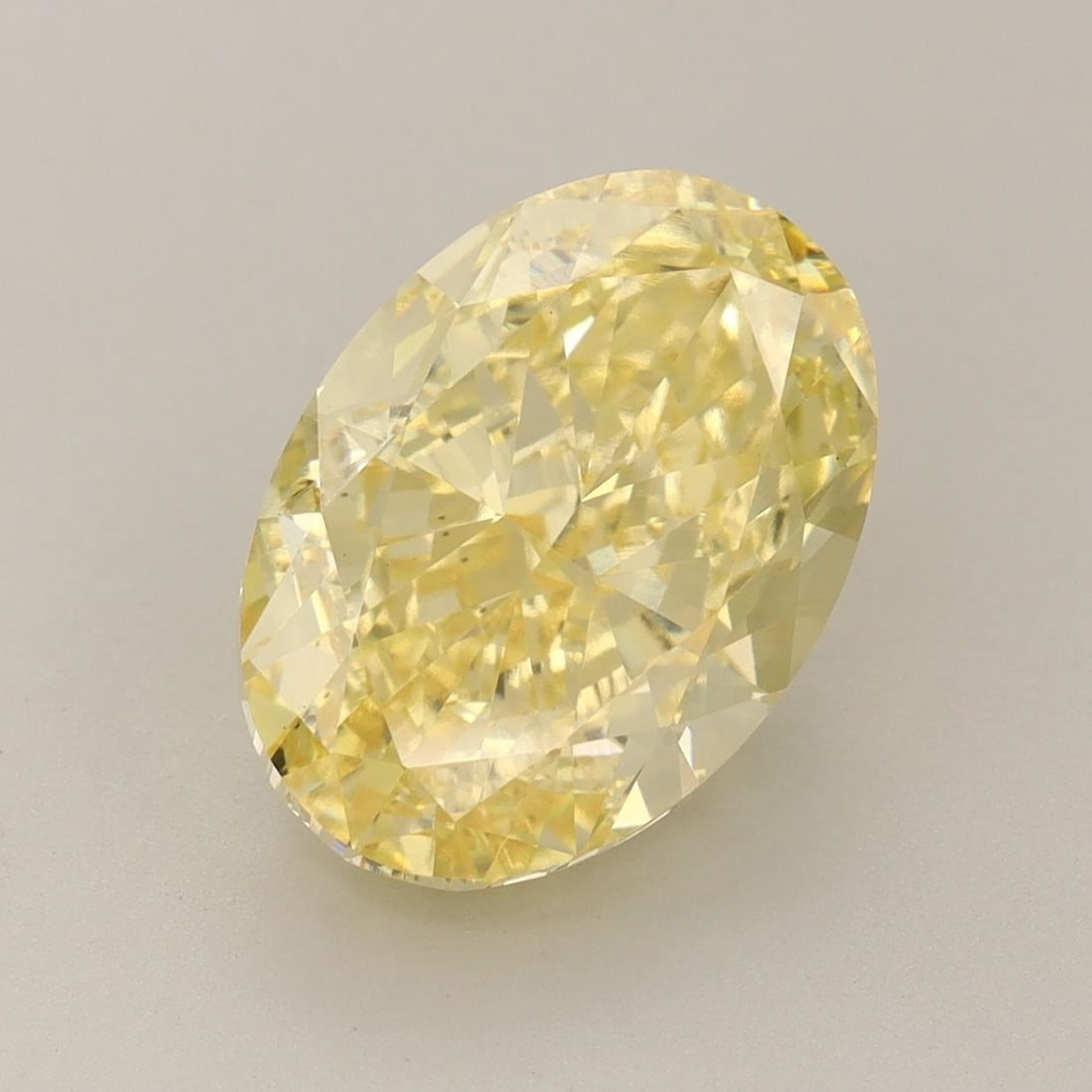 Loose Diamond - OVAL 5.36ct Fancy Vivid Yellow VS1: Loose Diamond - OVAL 5.36ct Fancy Vivid Yellow VS1 Source: This is a real non-mined Diamond that has been grown in a lab Shape: OVAL Carats: 5.36 Color: Fancy Vivid Yellow Certification: IGI Video: