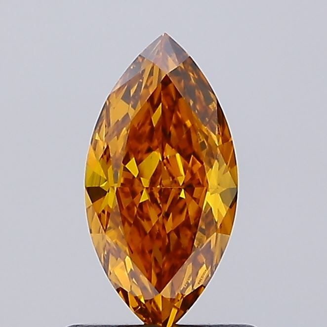 Loose Diamond - MARQUISE 0.81ct Fancy Vivid Orangey Yellow VS1: Loose Diamond - MARQUISE 0.81ct Fancy Vivid Orangey Yellow VS1 Source: This is a real non-mined Diamond that has been grown in a lab Shape: MARQUISE Carats: 0.81 Color: Fancy Vivid Orangey Yellow Cert