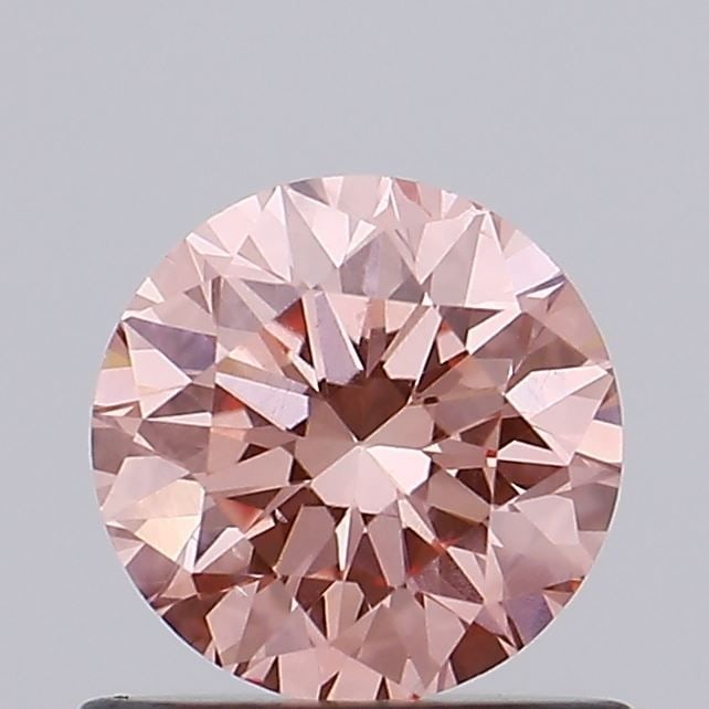 Loose Diamond - ROUND 0.67ct Fancy Vivid Pink VS2: Loose Diamond - ROUND 0.67ct Fancy Vivid Pink VS2 Source: This is a real non-mined Diamond that has been grown in a lab Shape: ROUND Carats: 0.67 Color: Fancy Vivid Pink Certification: IGI Video: