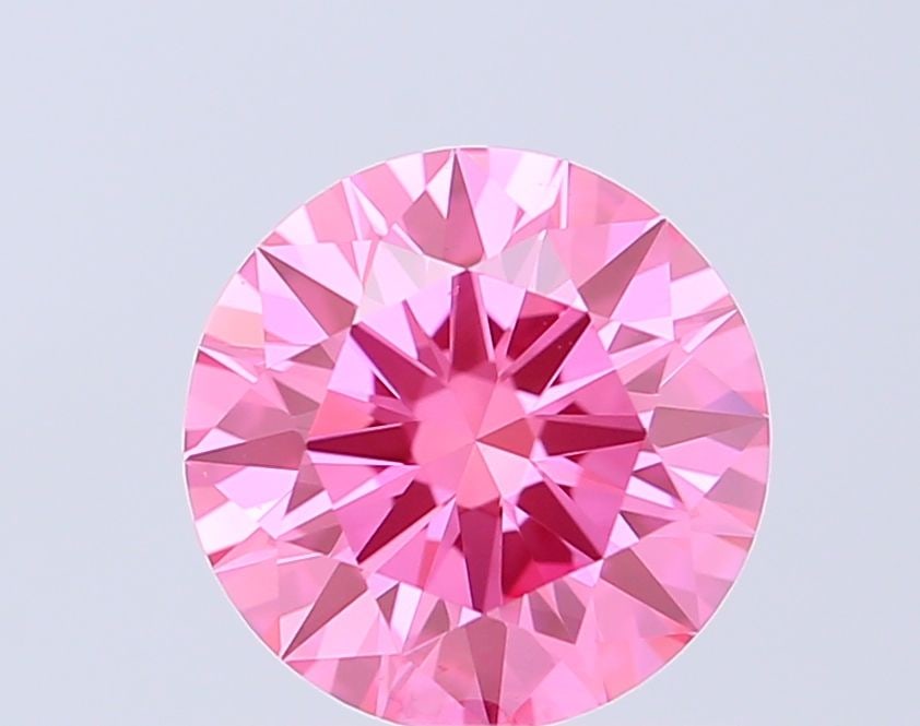 Ideal Loose Diamond - ROUND 1.06ct Fancy Vivid Pink VS1: Ideal Loose Diamond - ROUND 1.06ct Fancy Vivid Pink VS1 Source: This is a real non-mined Diamond that has been grown in a lab Shape: ROUND Carats: 1.06 Color: Fancy Vivid Pink Certification: IGI Video