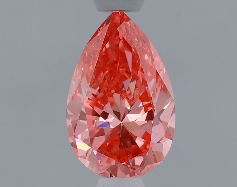 Loose Diamond - PEAR 0.92ct Fancy Vivid Pink VS1: Loose Diamond - PEAR 0.92ct Fancy Vivid Pink VS1 Source: This is a real non-mined Diamond that has been grown in a lab Shape: PEAR Carats: 0.92 Color: Fancy Vivid Pink Certification: IGI Video: