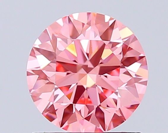 Ideal Loose Diamond - ROUND 1.03ct Fancy Vivid Pink VS1: Ideal Loose Diamond - ROUND 1.03ct Fancy Vivid Pink VS1 Source: This is a real non-mined Diamond that has been grown in a lab Shape: ROUND Carats: 1.03 Color: Fancy Vivid Pink Certification: IGI Video