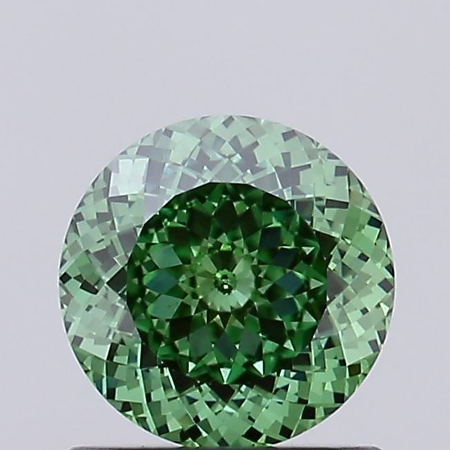 Loose Diamond - ROUND 0.81ct Fancy Vivid Green VS1: Loose Diamond - ROUND 0.81ct Fancy Vivid Green VS1 Source: This is a real non-mined Diamond that has been grown in a lab Shape: ROUND Carats: 0.81 Color: Fancy Vivid Green Certification: IGI Video: