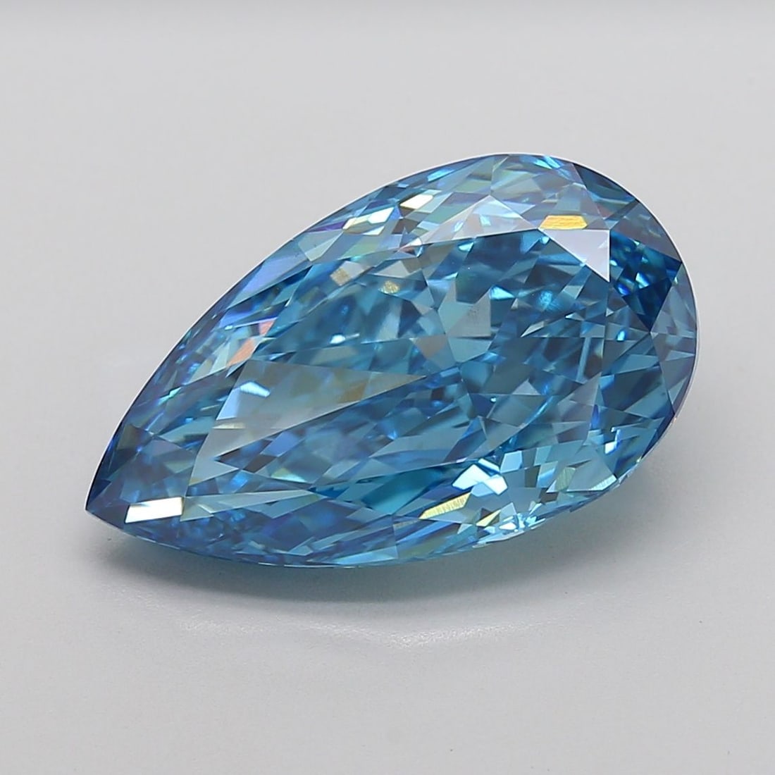 Loose Diamond - PEAR 12.05ct Fancy Vivid Blue VS1: Loose Diamond - PEAR 12.05ct Fancy Vivid Blue VS1 Source: This is a real non-mined Diamond that has been grown in a lab Shape: PEAR Carats: 12.05 Color: Fancy Vivid Blue Certification: IGI Video:
