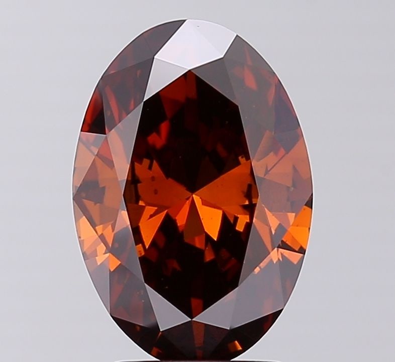 Loose Diamond - OVAL 3.0ct Fancy Deep Orange Brown VS2: Loose Diamond - OVAL 3.0ct Fancy Deep Orange Brown VS2 Source: This is a real non-mined Diamond that has been grown in a lab Shape: OVAL Carats: 3.0 Color: Fancy Deep Orange Brown Certification: IGI V