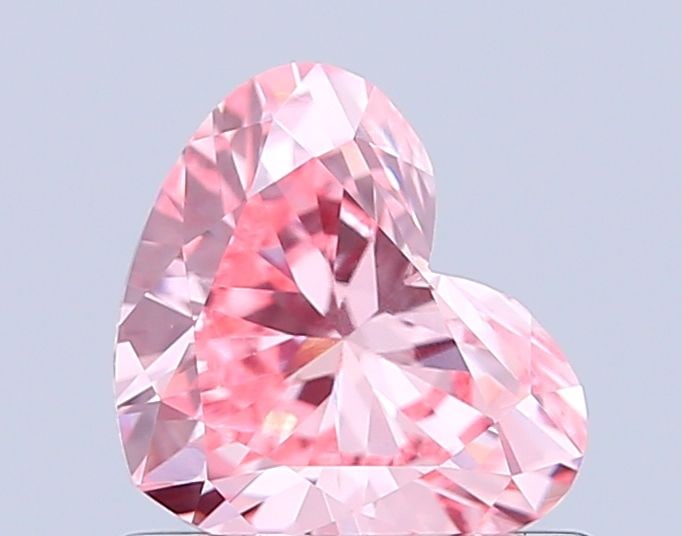Loose Diamond - HEART 0.7ct Fancy Vivid Pink VVS2: Loose Diamond - HEART 0.7ct Fancy Vivid Pink VVS2 Source: This is a real non-mined Diamond that has been grown in a lab Shape: HEART Carats: 0.7 Color: Fancy Vivid Pink Certification: IGI Video: