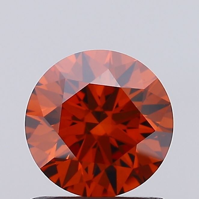 Ideal Loose Diamond - ROUND 1.03ct Fancy Vivid Orange VS1: Ideal Loose Diamond - ROUND 1.03ct Fancy Vivid Orange VS1 Source: This is a real non-mined Diamond that has been grown in a lab Shape: ROUND Carats: 1.03 Color: Fancy Vivid Orange Certification: IGI V