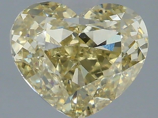 Loose Diamond - HEART 2.03ct Fancy Yellow VS1: Loose Diamond - HEART 2.03ct Fancy Yellow VS1 Source: This is a real non-mined Diamond that has been grown in a lab Shape: HEART Carats: 2.03 Color: Fancy Yellow Certification: IGI Video: