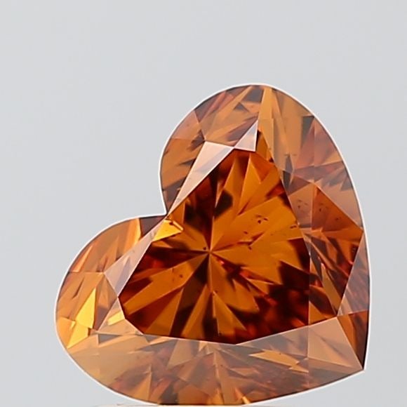 Loose Diamond - HEART 2.08ct Fancy Vivid Brownish Orange SI1: Loose Diamond - HEART 2.08ct Fancy Vivid Brownish Orange SI1 Source: This is a real non-mined Diamond that has been grown in a lab Shape: HEART Carats: 2.08 Color: Fancy Vivid Brownish Orange Certific