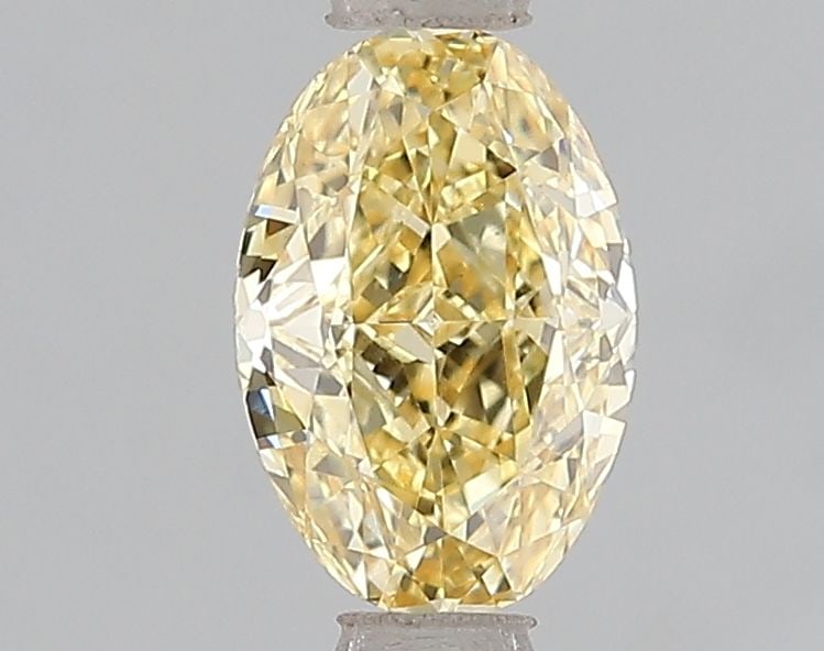 Loose Diamond - OVAL 1.11ct Fancy Vivid Yellow VS1: Loose Diamond - OVAL 1.11ct Fancy Vivid Yellow VS1 Source: This is a real non-mined Diamond that has been grown in a lab Shape: OVAL Carats: 1.11 Color: Fancy Vivid Yellow Certification: IGI Video: