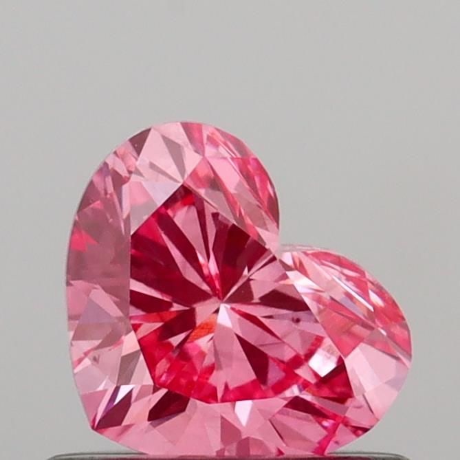 Loose Diamond - HEART 0.6ct Fancy Vivid Pink VS2: Loose Diamond - HEART 0.6ct Fancy Vivid Pink VS2 Source: This is a real non-mined Diamond that has been grown in a lab Shape: HEART Carats: 0.6 Color: Fancy Vivid Pink Certification: IGI Video: