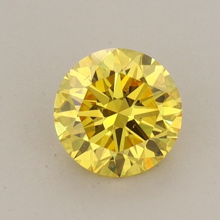 Loose Diamond - ROUND 0.68ct Fancy Vivid Yellow VS1: Loose Diamond - ROUND 0.68ct Fancy Vivid Yellow VS1 Source: This is a real non-mined Diamond that has been grown in a lab Shape: ROUND Carats: 0.68 Color: Fancy Vivid Yellow Certification: IGI Video: