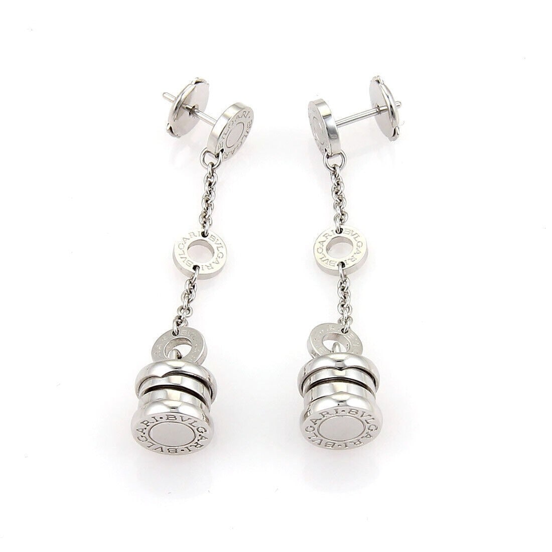 Bvlgari B.zero1 18k White Gold Drop Dangle Earrings: Bvlgari B.zero1 18k White Gold Drop Dangle Earrings Bvlgari B.zero1 dangling earrings crafted in 18k white gold with a dangle/drop style. The design features four engraved B.zero1 disc charms with cha