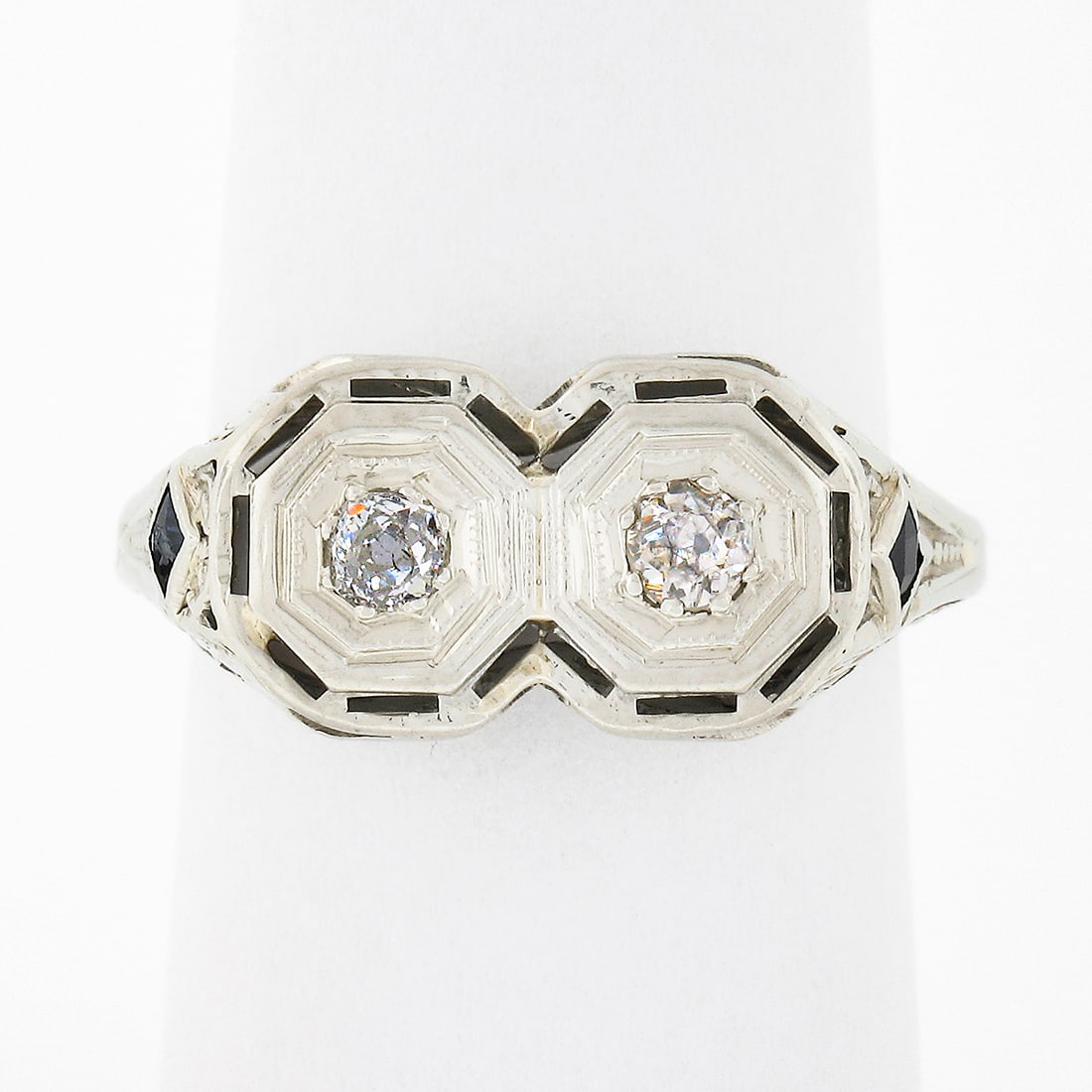 Antique Art Deco 18k White Gold Dual Diamond and Sapphire Filigree Ring: Antique Art Deco 18k White Gold Dual Diamond and Sapphire Filigree Ring This exquisite antique Art Deco ring is crafted from solid 18k white gold and features a stunning design that showcases two old 