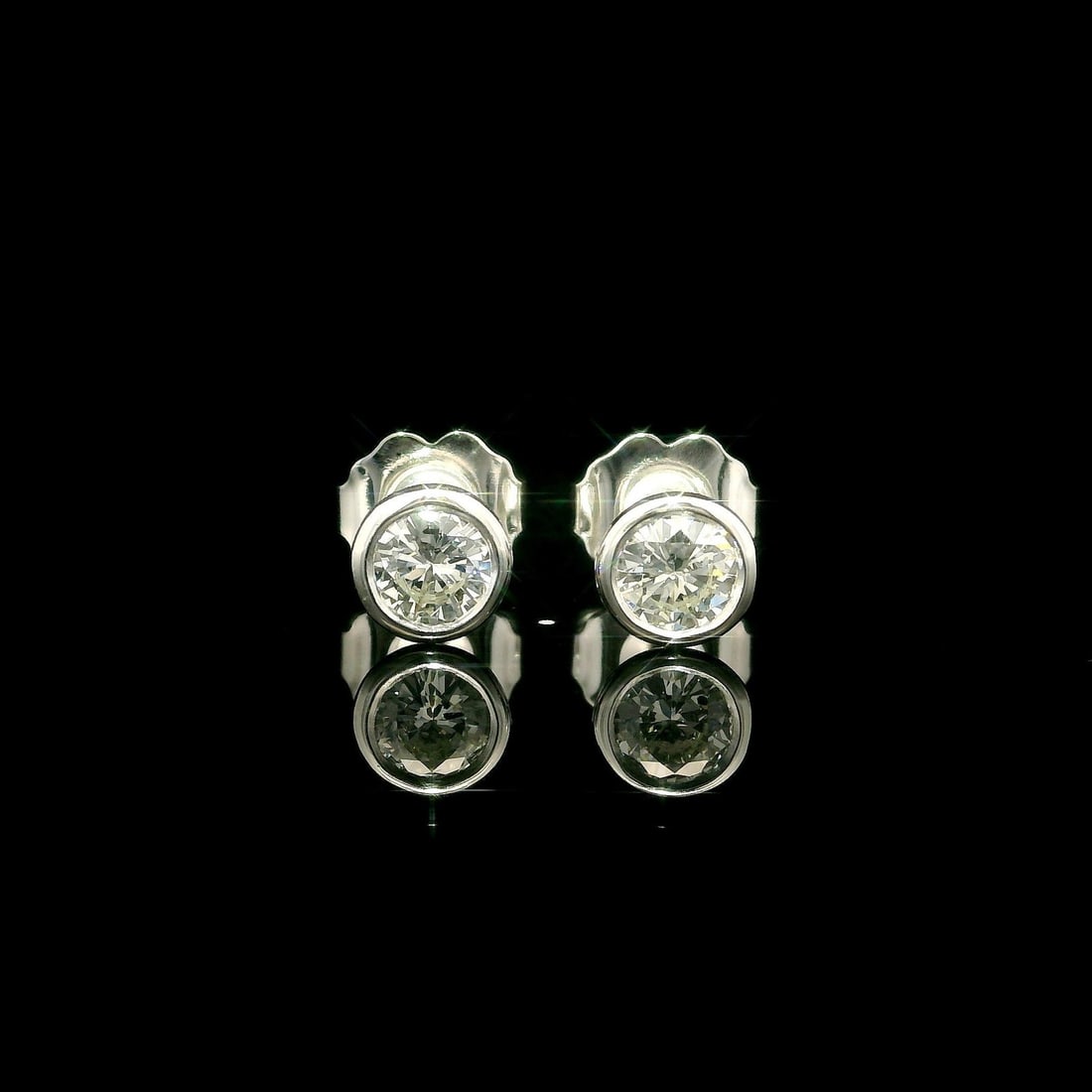 14k White Gold 0.33ctw Martini Bezel Diamond Stud Earrings: 14k White Gold 0.33ctw Martini Bezel Diamond Stud Earrings Elevate your elegance with these stunning stud earrings crafted from solid 14k white gold. Each earring features a round brilliant cut diamon