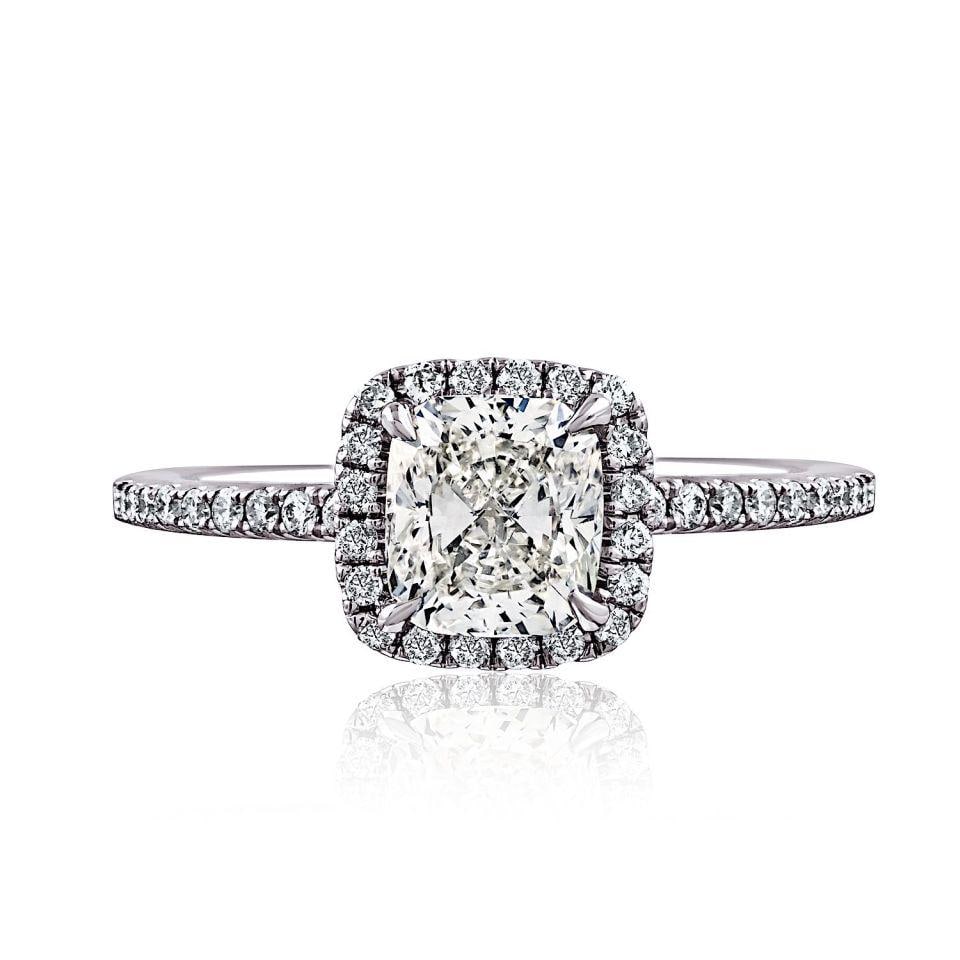18K White Gold Halo Engagement Ring 0.91ct Cushion Diamond GIA J VS2: 18K White Gold Halo Engagement Ring 0.91ct Cushion Diamond GIA J VS2 Pre-owned engagement ring featuring a GIA-certified 0.91 ct cushion cut diamond with a halo setting and pave-set shoulders. Crafted