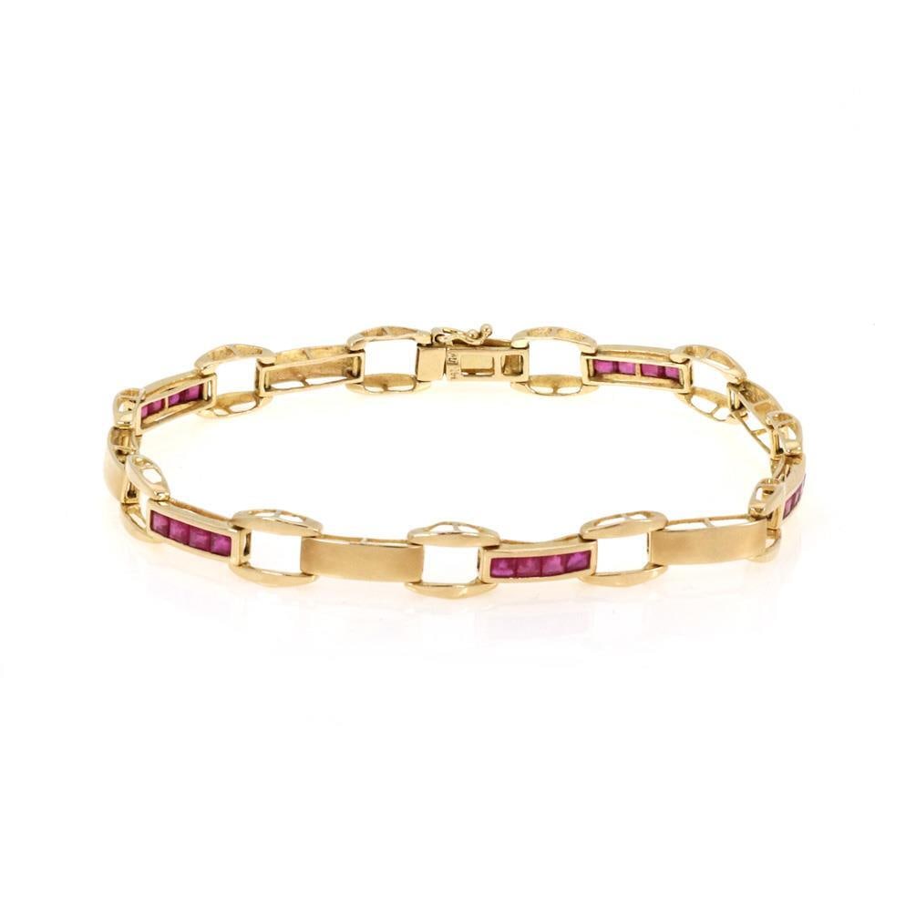 Vintage 1.50ct Square Cut Ruby 14k Yellow Gold Bracelet: Vintage 1.50ct Square Cut Ruby 14k Yellow Gold Bracelet This exquisite vintage bracelet is crafted from 14k yellow gold and features long bar links adorned with square-cut rubies. The design showcases