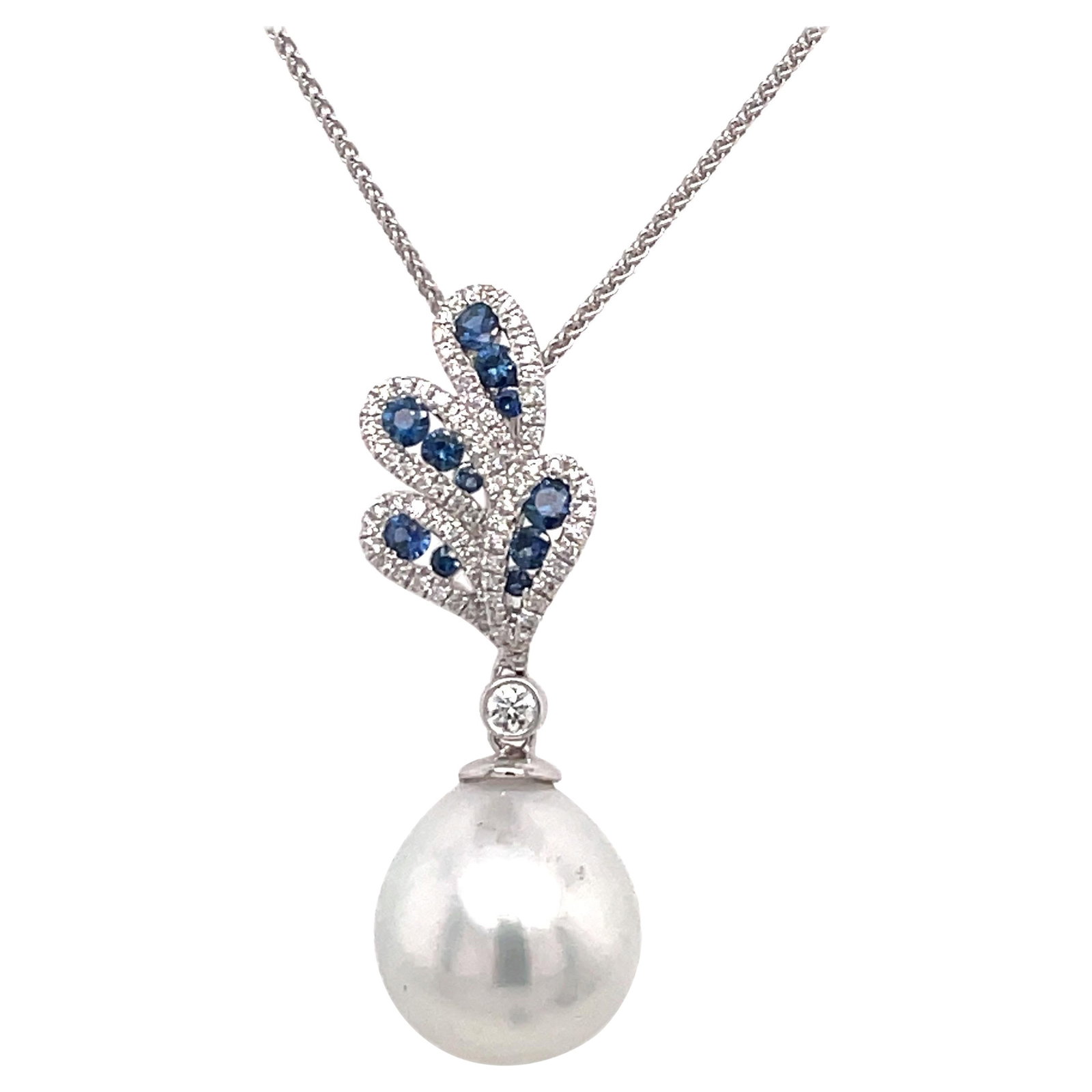 Harbor Diamonds 18K White Gold Floral Pendant with South Sea Pearl and 0.80 Carats Diamonds and: Harbor Diamonds 18K White Gold Floral Pendant with South Sea Pearl and 0.80 Carats Diamonds and Sapphires This exquisite pendant is crafted from 18K White Gold and features a stunning South Sea Pearl 
