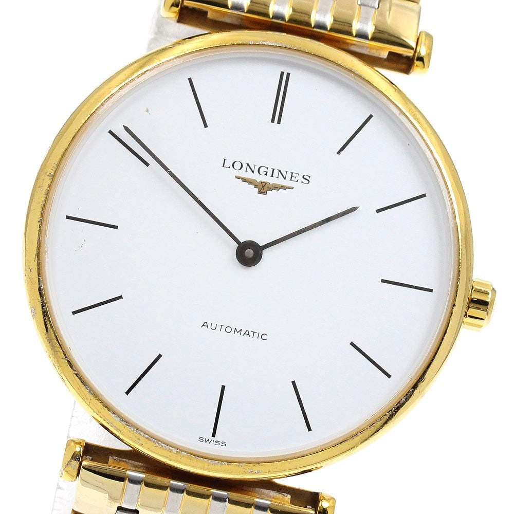 Longines Grand Classic automatic men's wristwatch 34mm white dial: Longines Grand Classic automatic men's wristwatch 34mm white dial This Longines L4.708.2 Grand Classic men's wristwatch features a stainless steel and gold case and bracelet, complemented by a white d