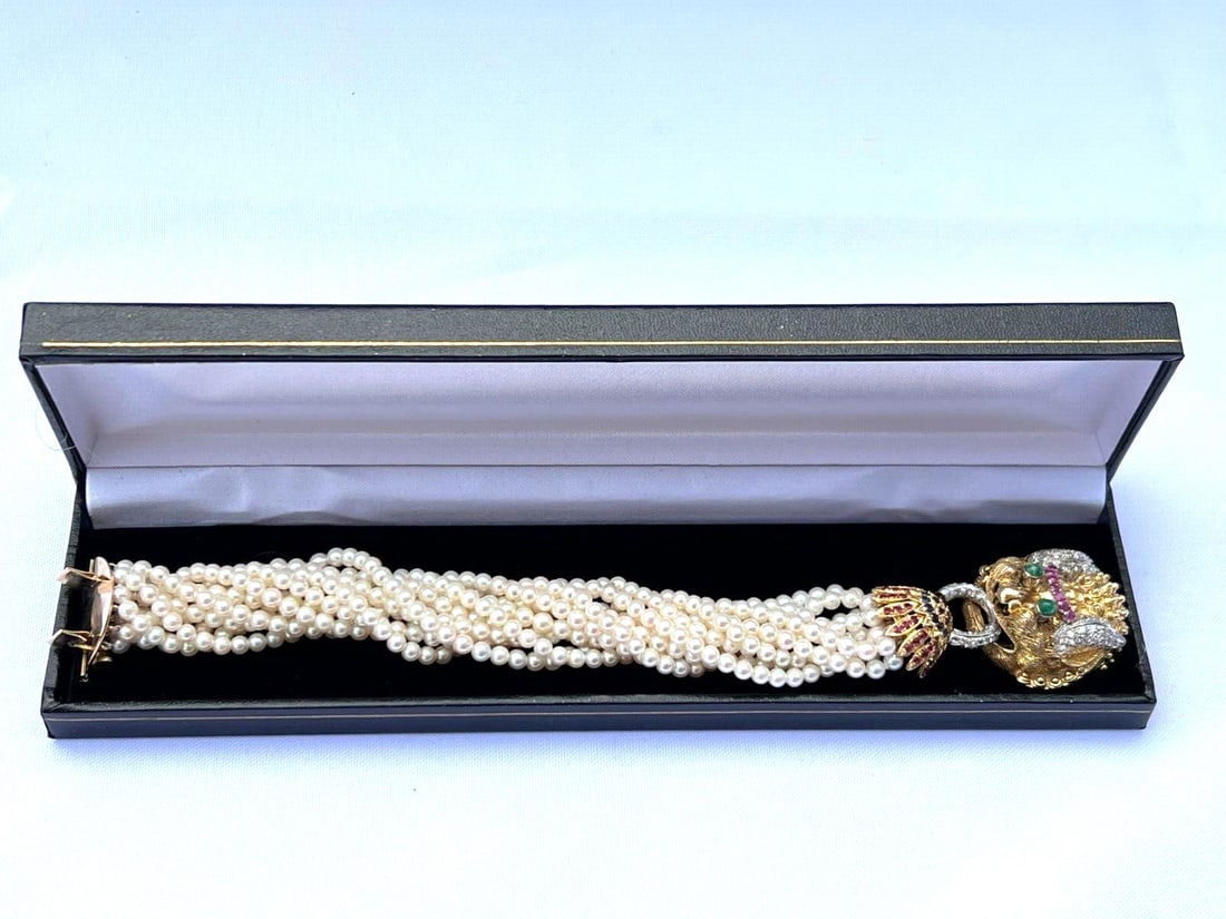 14K Yellow Gold Ruby Sapphire Emerald Diamond Pearl Bracelet: 14K Yellow Gold Ruby Sapphire Emerald Diamond Pearl Bracelet Discover the elegance of this stunning 14K yellow gold bracelet, exquisitely adorned with cultured pearls, diamonds, rubies, sapphires, and