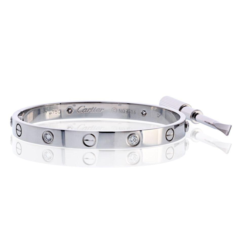 Cartier Love Bracelet 18K White Gold 4 Diamonds Size 17: Cartier Love Bracelet 18K White Gold 4 Diamonds Size 17 This exquisite Cartier Love bracelet is crafted from 18K white gold and weighs 32.1 grams. Sized at 17, it showcases four brilliant round-cut di