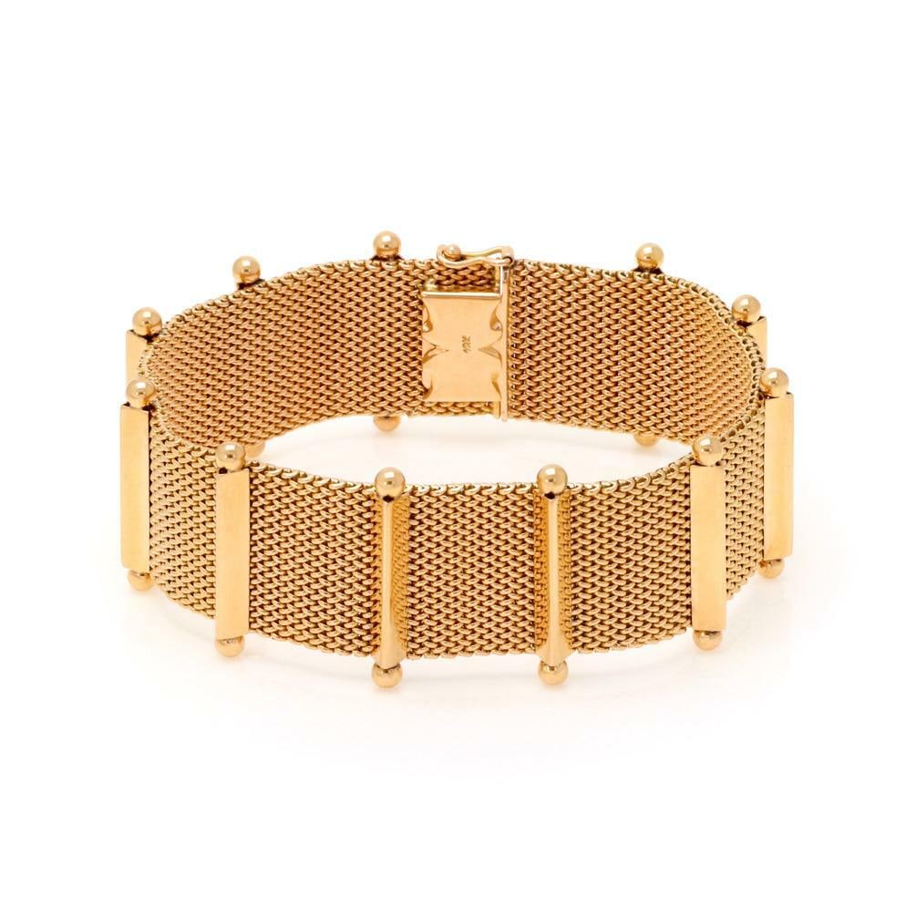 Elegant 18k Rose Gold Mesh Flex Bracelet with Cross Bars: Elegant 18k Rose Gold Mesh Flex Bracelet with Cross Bars This exquisite mesh style bracelet is crafted from 18k rose gold, showcasing a unique design with 11 polished cross bars distributed along its 