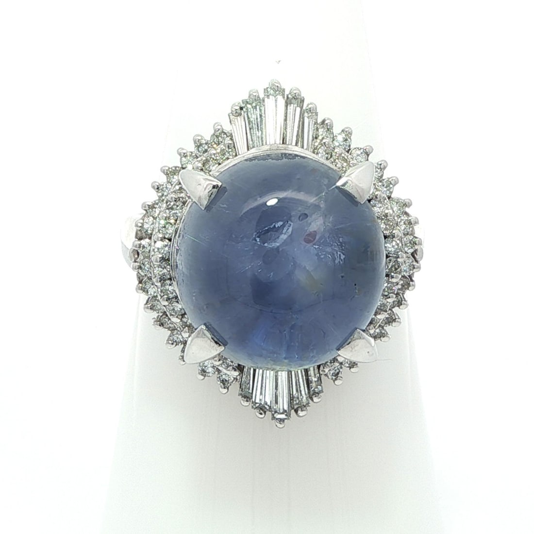 Vintage GIA Certified 13.89ct Blue Star Sapphire Diamond Ring in Platinum: Vintage GIA Certified 13.89ct Blue Star Sapphire Diamond Ring in Platinum This vintage cocktail ring showcases a stunning 13.29ct natural blue star sapphire, featuring an oval double cabochon cut that