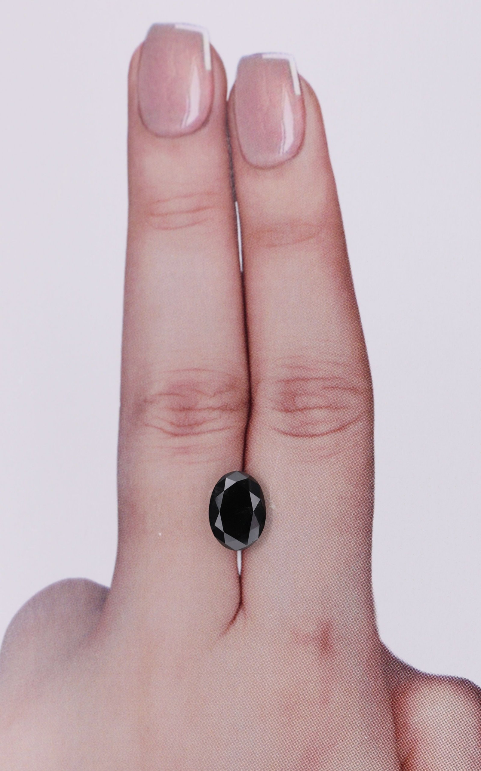 Loose Diamond - OVAL 1.88ct Black: Loose Diamond - OVAL 1.88ct Black Source: Natural Shape: OVAL Carats: 1.88 Color: Black Certification: IGI Video: