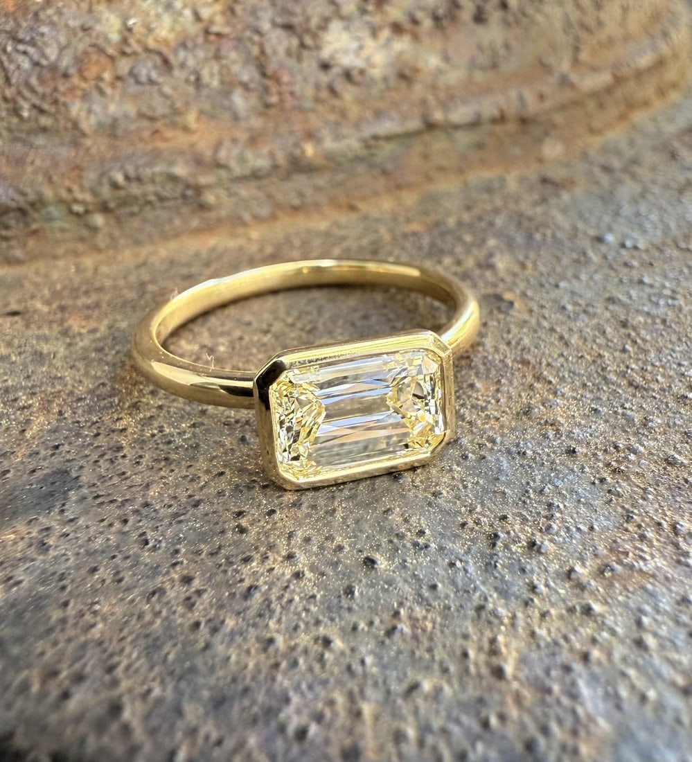 GIA Certified 18k Yellow Gold Bezel Diamond Ring 1.70ct Size 6.5: GIA Certified 18k Yellow Gold Bezel Diamond Ring 1.70ct Size 6.5 This elegant ring features a unique, natural rectangular diamond set east-west in a secure bezel setting. Crafted from solid 18k yellow