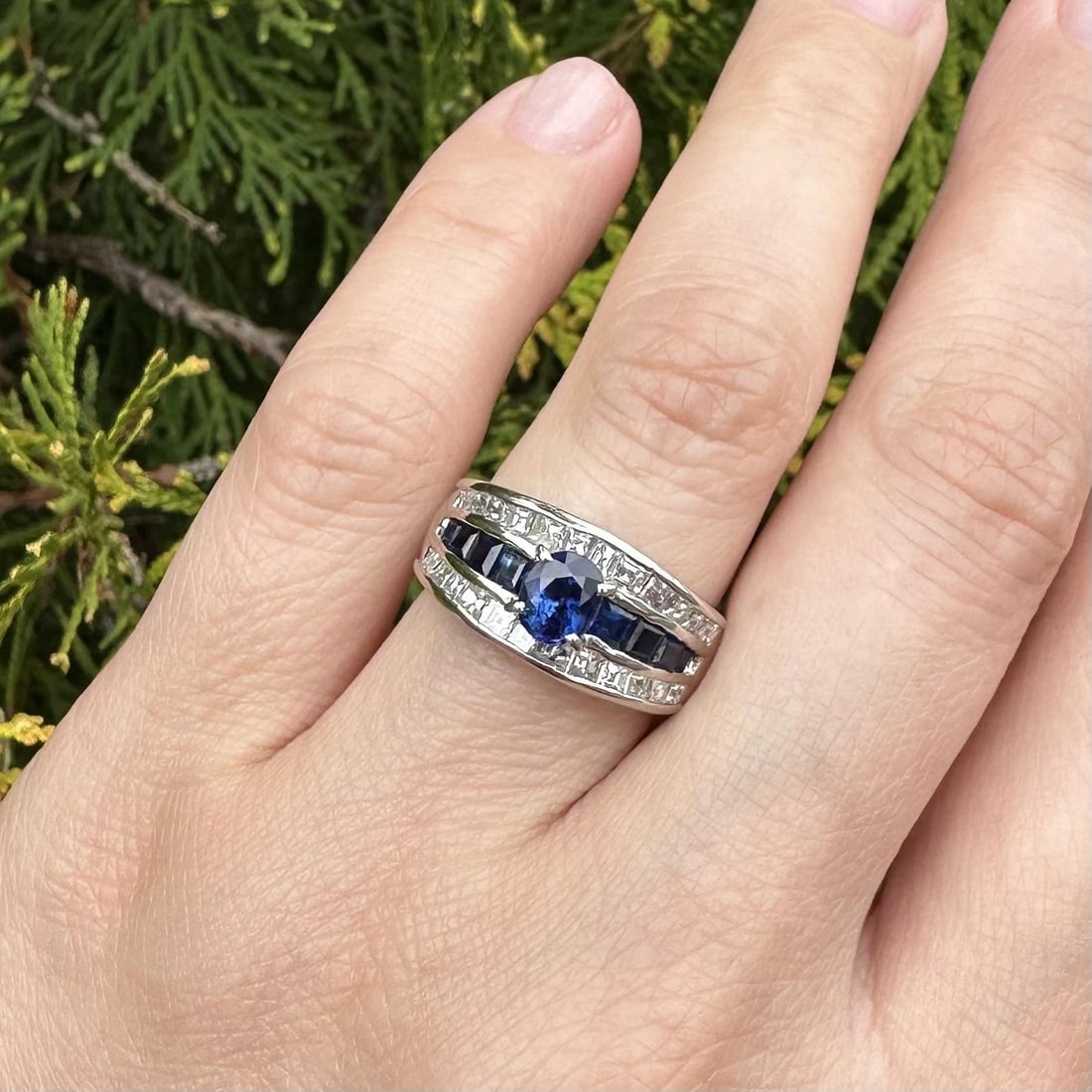 Platinum Sapphire Diamond Band Ring Size 7 PT900: Platinum Sapphire Diamond Band Ring Size 7 PT900 This platinum band ring features a striking combination of royal blue sapphires and carre cut diamonds. The design includes nine natural sapphires--one