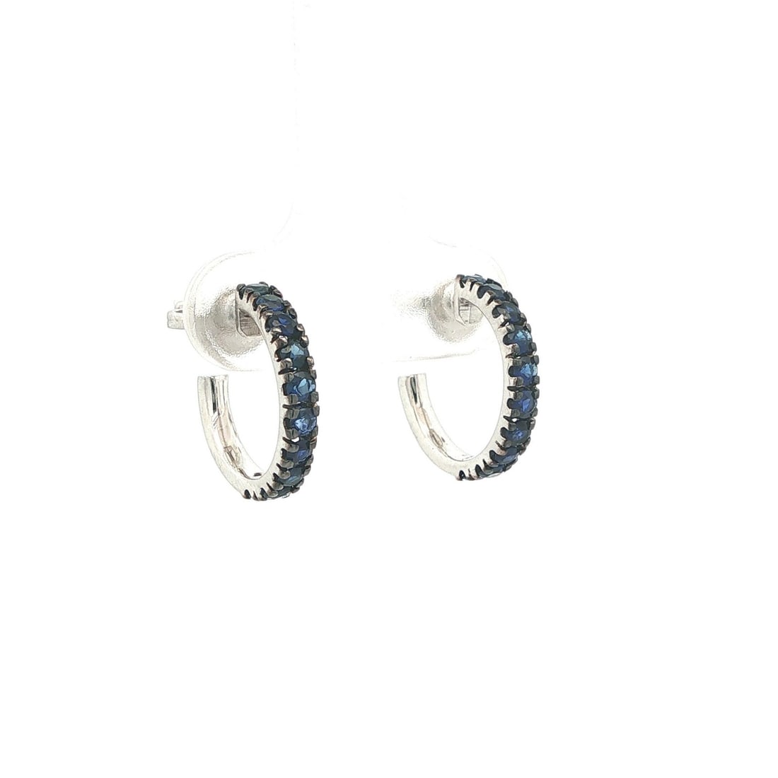 18k White Gold Cuff Hoop Earrings with Royal Blue Sapphire: 18k White Gold Cuff Hoop Earrings with Royal Blue Sapphire These cuff hoop earrings feature 20 natural royal blue sapphires, each round brilliant cut and pave set, with a total carat weight of approxi