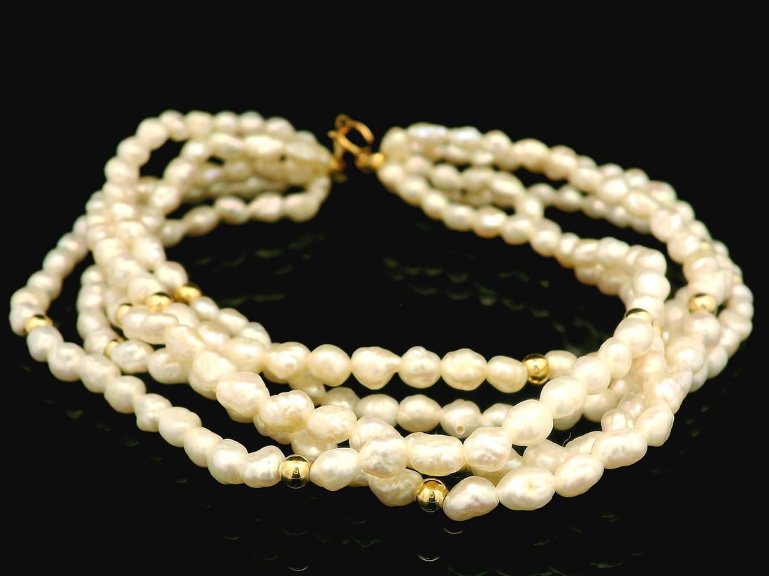 Estate Multi-Strand Baroque Pearl Bracelet with 14k Yellow Gold Beads: Estate Multi-Strand Baroque Pearl Bracelet with 14k Yellow Gold Beads This exquisite multi-strand bracelet showcases numerous genuine freshwater baroque pearls, featuring a stunning white body color t