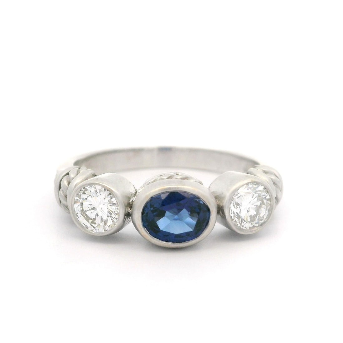 Judith Ripka 1.80ct Oval Sapphire Diamond White Gold Ring: Judith Ripka 1.80ct Oval Sapphire Diamond White Gold Ring This exquisite Judith Ripka ring showcases a stunning natural oval sapphire set in a bezel, highlighted by two round brilliant cut diamonds. T