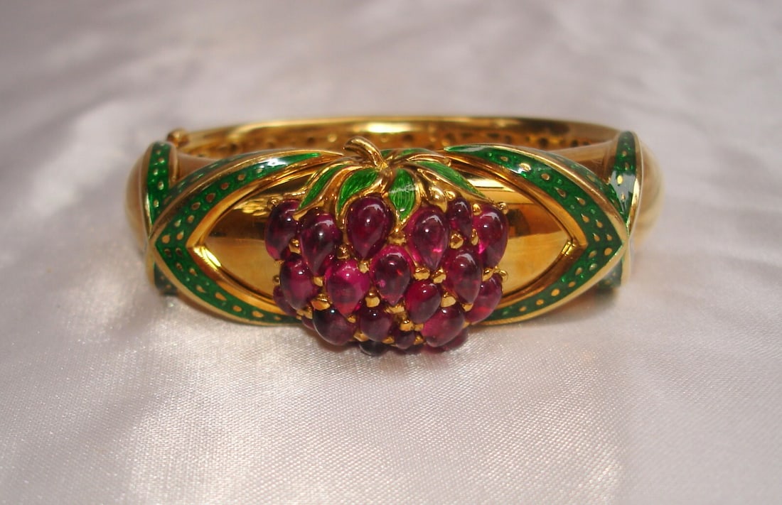18K Yellow Gold Cuff Bracelet With Pink Tourmaline Enamel by Mavito: 18K Yellow Gold Cuff Bracelet With Pink Tourmaline Enamel by Mavito This is a mid-1900s Mavito cuff bracelet crafted from 18K yellow gold, featuring pink tourmaline cabochons with a total weight of 9 