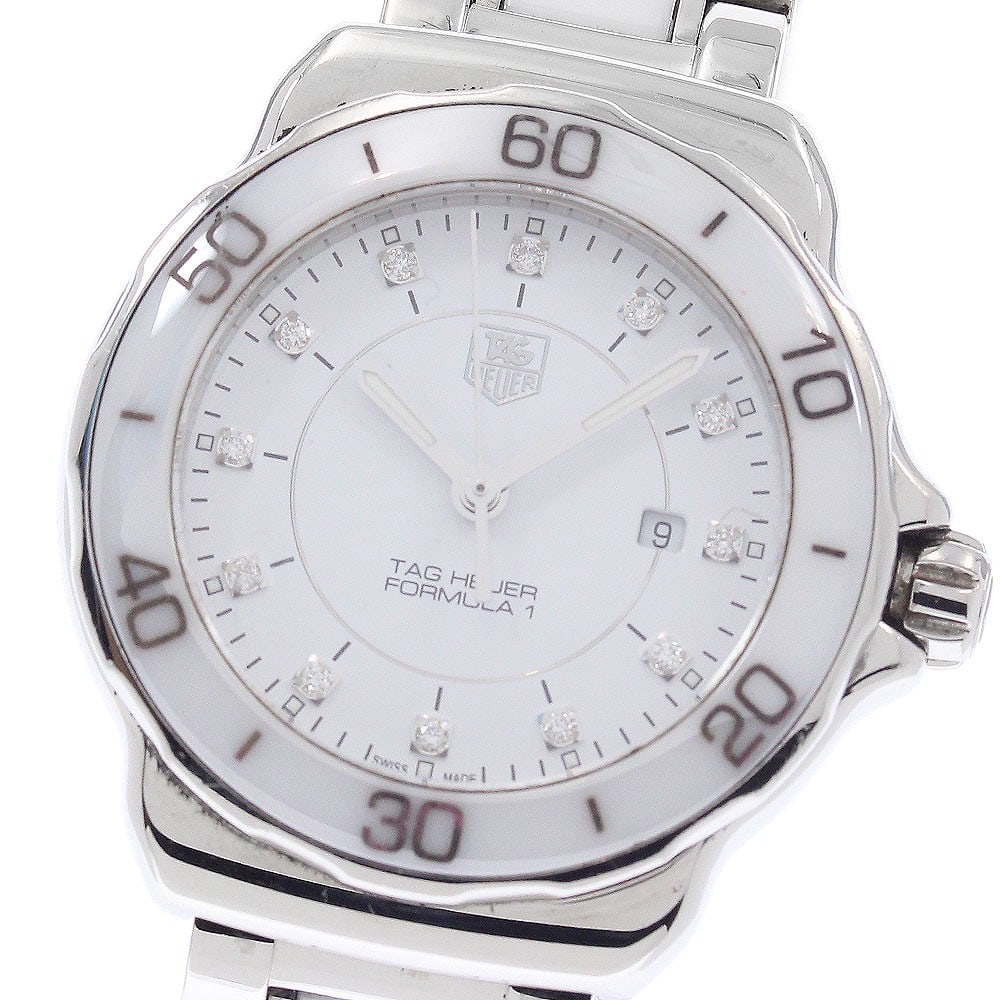 TAG Heuer Formula 1 quartz date women's wristwatch WAH1315: TAG Heuer Formula 1 quartz date women's wristwatch WAH1315 This TAG Heuer Formula 1 WAH1315 is a women's wristwatch featuring a stainless steel and ceramic case and band, paired with a white dial. The
