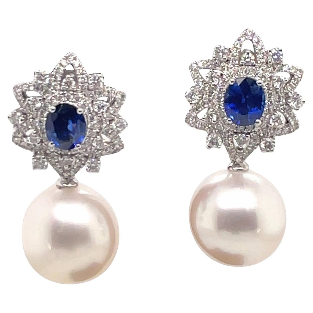 Harbor Diamonds 18K White Gold Sapphire Diamond Floral Drop Earrings: Harbor Diamonds 18K White Gold Sapphire Diamond Floral Drop Earrings Elevate your elegance with these stunning 18 Karat White Gold Sapphire Diamond Floral Drop Day & Night Earrings. These contemporary