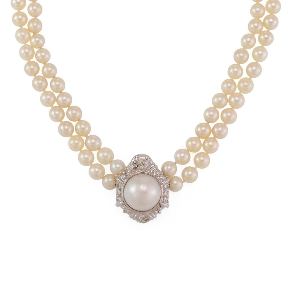 Estate 14k White Gold Diamond Mabe Pearl Pendant Necklace: Estate 14k White Gold Diamond Mabe Pearl Pendant Necklace This exquisite estate necklace features a stunning pendant crafted from 14k white gold, showcasing a fancy octagonal frame adorned with 75 poi