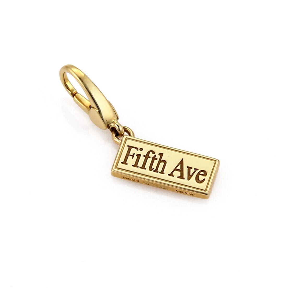 Bvlgari Fifth Ave Sign 18k Yellow Gold Pendant Charm: Bvlgari Fifth Ave Sign 18k Yellow Gold Pendant Charm This Bvlgari Fifth Ave Sign charm pendant is crafted in 18k yellow gold with a polished finish and a sleek, minimalist silhouette. It is signed, ma