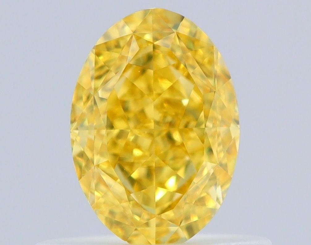 Loose Diamond - OVAL 0.63ct Fancy Vivid Yellow VVS1: Loose Diamond - OVAL 0.63ct Fancy Vivid Yellow VVS1 Source: Natural Shape: OVAL Carats: 0.63 Color: Fancy Vivid Yellow Certification: GIA Video: