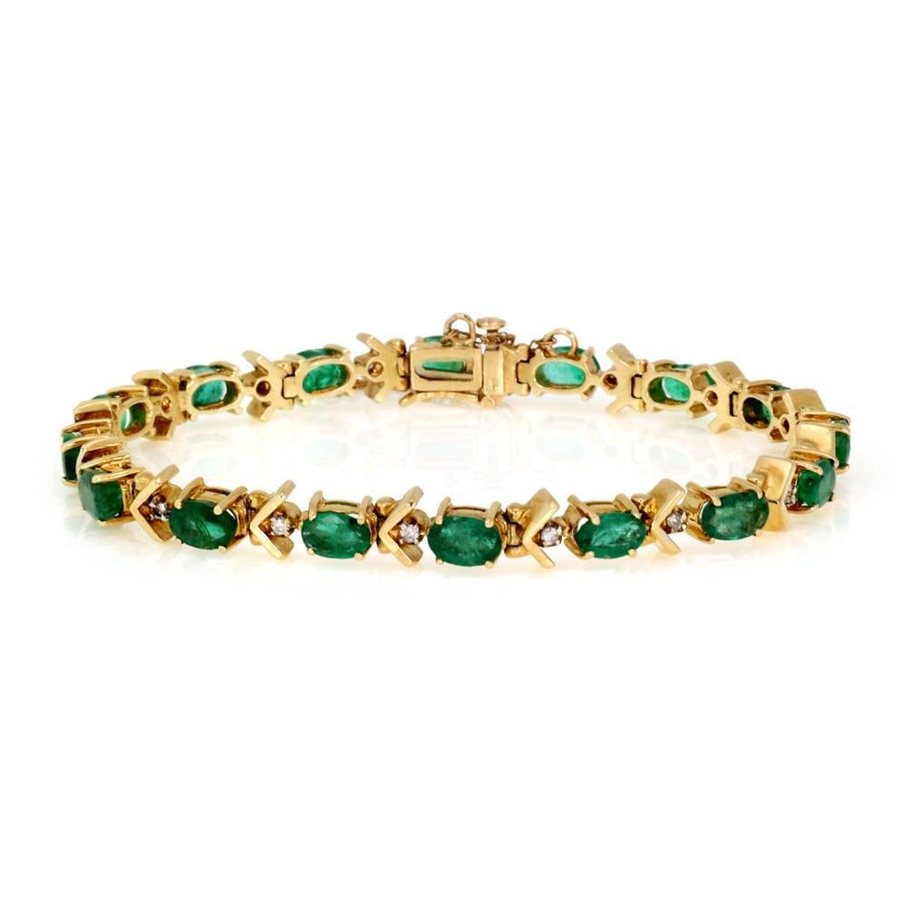 7ct Diamond and Emerald 14k Yellow Gold Tennis Bracelet: 7ct Diamond and Emerald 14k Yellow Gold Tennis Bracelet This elegant tennis bracelet is crafted from 14k yellow gold and features a stunning design with alternating small round cut diamonds and oval-s