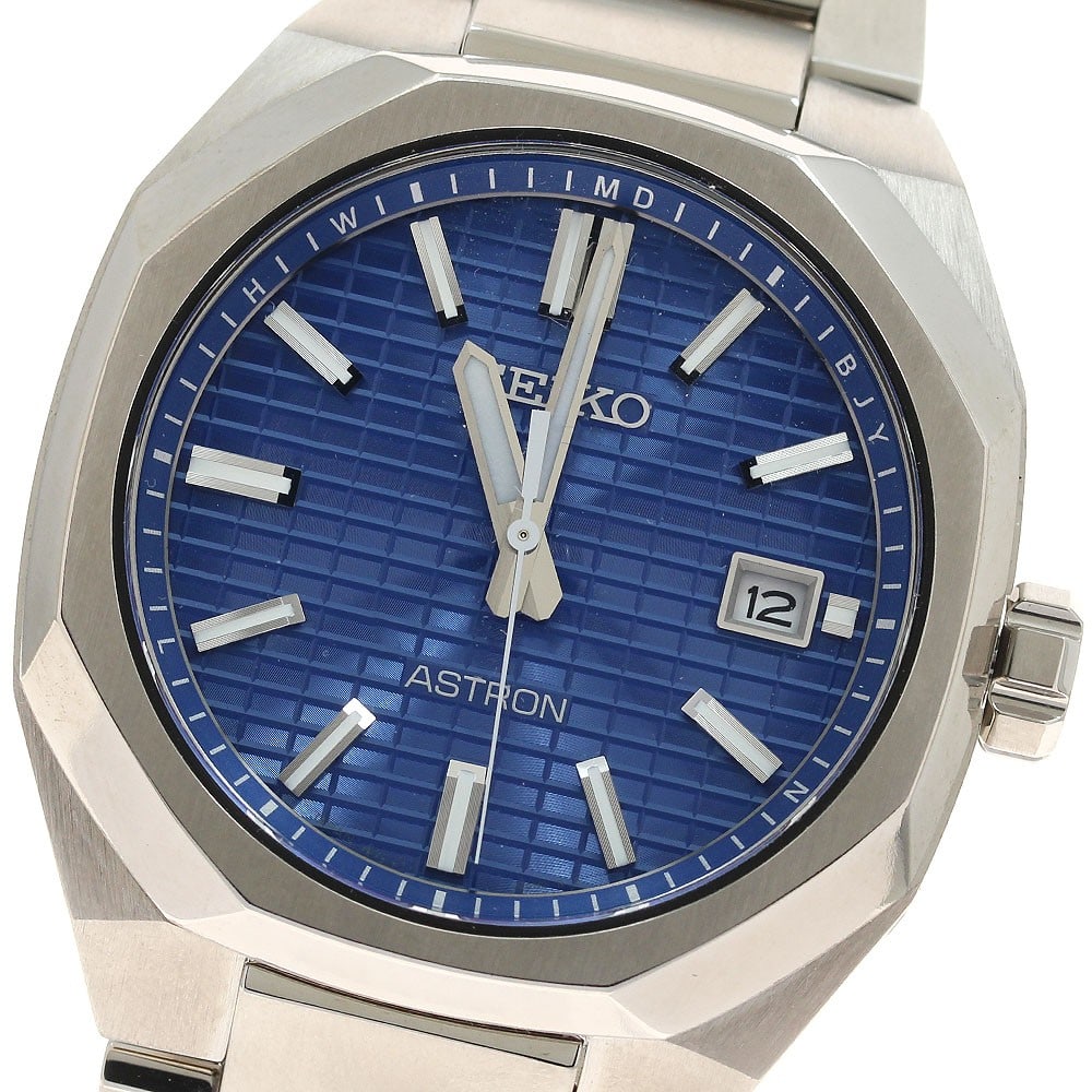 Seiko Astron Nextar Titanium Solar Radio Controlled Date Watch: Seiko Astron Nextar Titanium Solar Radio Controlled Date Watch This Seiko Astron Nextar men's wristwatch features a titanium case and band, offering both durability and a lightweight feel. The blue di