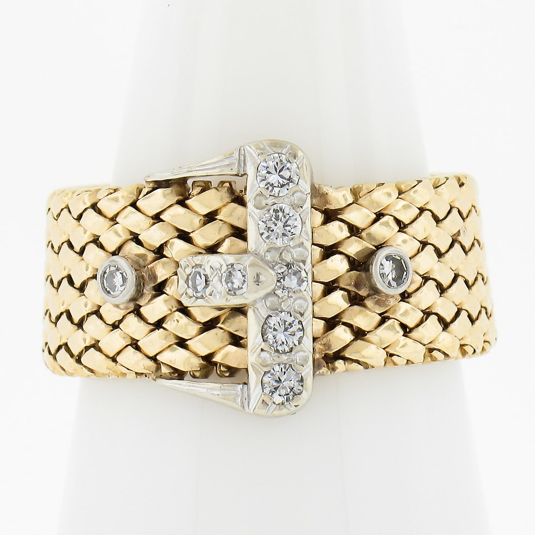 Vintage 14K Two Tone Gold 0.12ctw Diamond Buckle Band Ring: Vintage 14K Two Tone Gold 0.12ctw Diamond Buckle Band Ring This exquisite vintage ring showcases a stunning flexible weave design crafted from solid 14K two-tone gold, featuring both yellow and white 