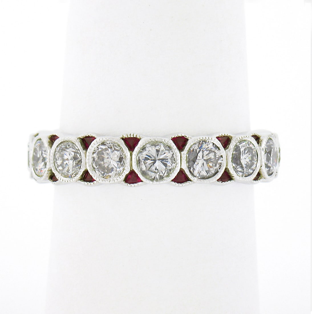 Platinum Ruby Diamond Eternity Wedding Band Ring Size 7: Platinum Ruby Diamond Eternity Wedding Band Ring Size 7 This elegant eternity wedding band ring is crafted from solid .950 platinum and features a striking combination of round brilliant cut diamonds 