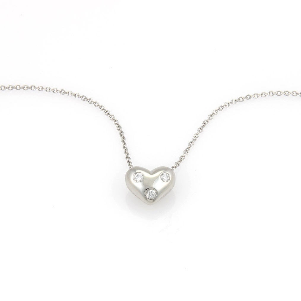 Tiffany & Co Etoile Platinum Heart Pendant Necklace 3 Diamond Slide: Tiffany & Co Etoile Platinum Heart Pendant Necklace 3 Diamond Slide A Tiffany & Co. Etoile pendant and chain necklace crafted in platinum with a heart-shaped pendant accented by three brilliant-cut na
