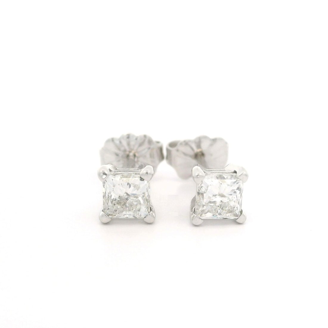 14k White Gold Princess Cut Diamond Stud Earrings 0.80ctw: 14k White Gold Princess Cut Diamond Stud Earrings 0.80ctw These un-used stud earrings feature two natural princess cut diamonds with a total carat weight of approximately 0.80 carats. The diamonds are