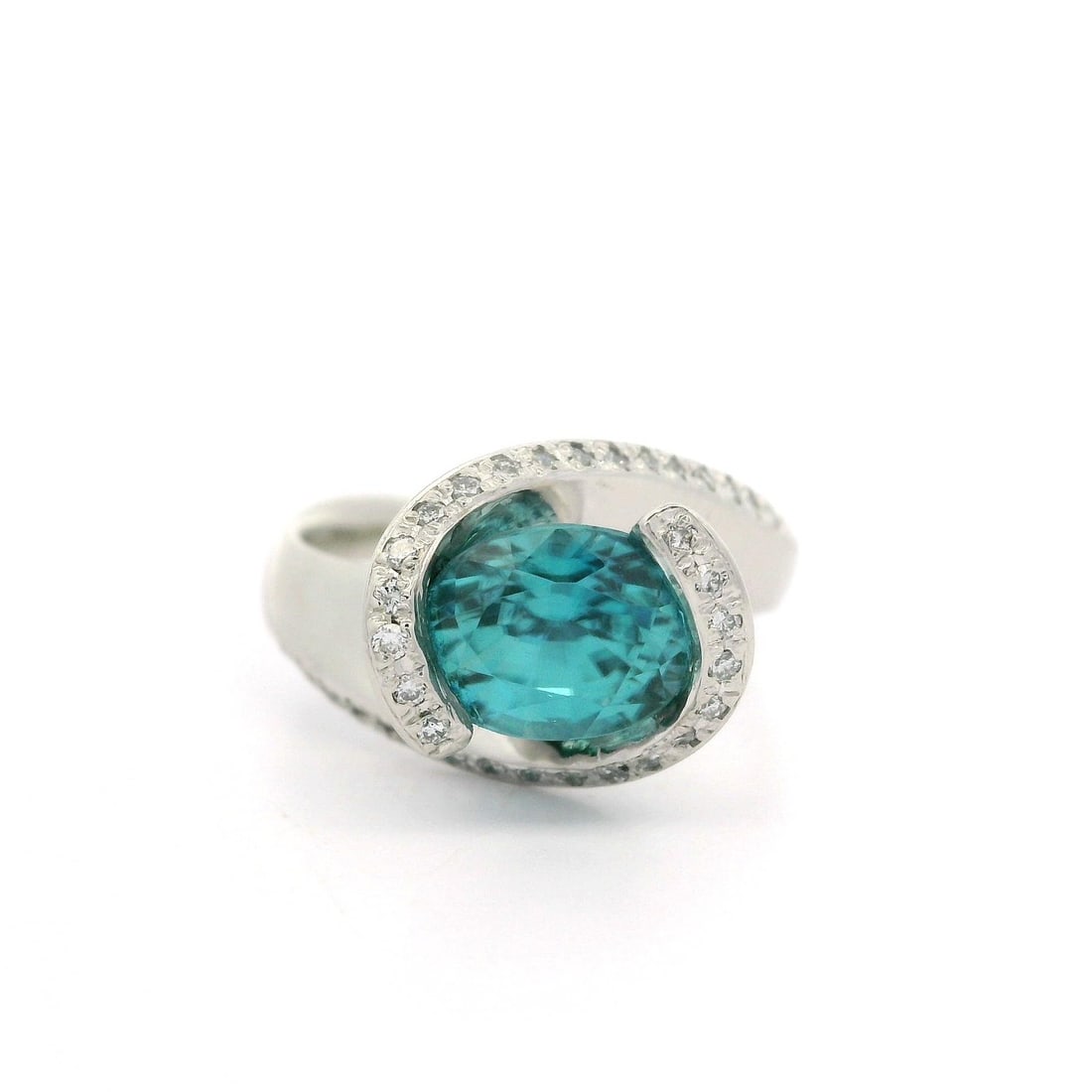 Platinum 3.29ctw Blue Zircon Diamond Bypass Ring Size 5.5: Platinum 3.29ctw Blue Zircon Diamond Bypass Ring Size 5.5 This stunning bypass style ring features a captivating 3.29ctw of sparkling gemstones set in solid platinum. At its center lies a magnificent 