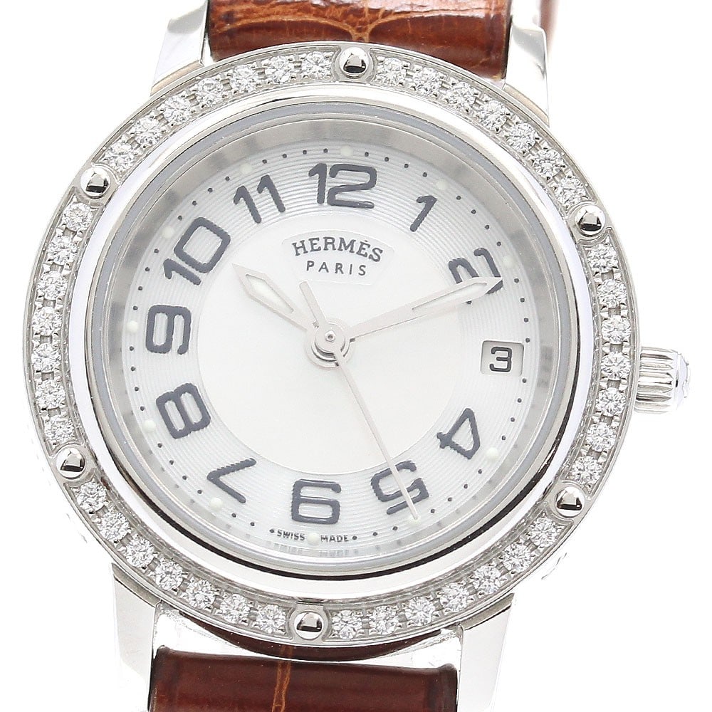 Hermes Clipper CP1.230 womens quartz wristwatch diamond bezel: Hermes Clipper CP1.230 womens quartz wristwatch diamond bezel Hermes CP1.230 Clipper diamond bezel quartz women's wristwatch. This pre-owned Swiss-made watch is designed for women and features a diamo