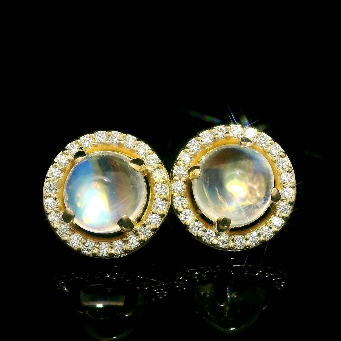 14k Yellow Gold Blue Moonstone Diamond Halo Stud Earrings: 14k Yellow Gold Blue Moonstone Diamond Halo Stud Earrings These exquisite stud earrings feature a stunning combination of natural blue moonstone and diamonds, set in luxurious 14k yellow gold. The rou