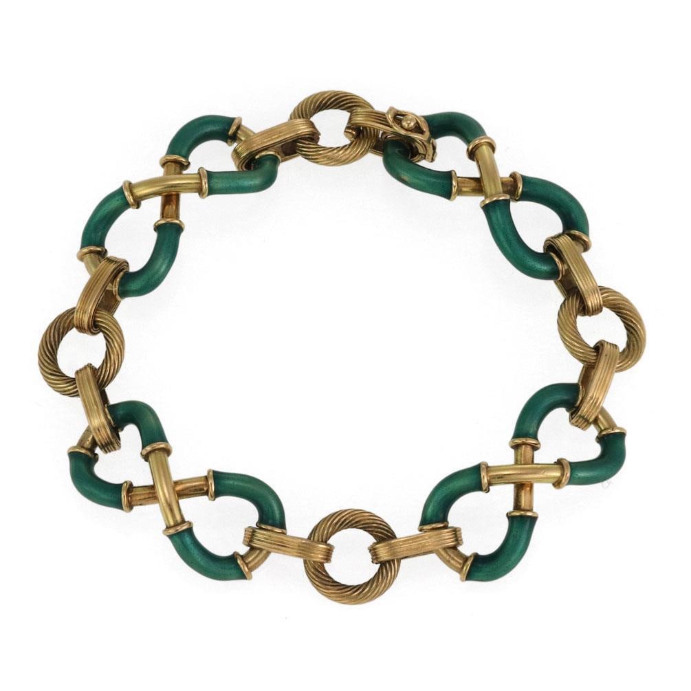 Vintage 18k Yellow Gold Green Enamel Infinity Bracelet 7 Inch: Vintage 18k Yellow Gold Green Enamel Infinity Bracelet 7 Inch This exquisite vintage bracelet is crafted from 18k yellow gold and features four infinity-style links adorned with vibrant green enamel. 